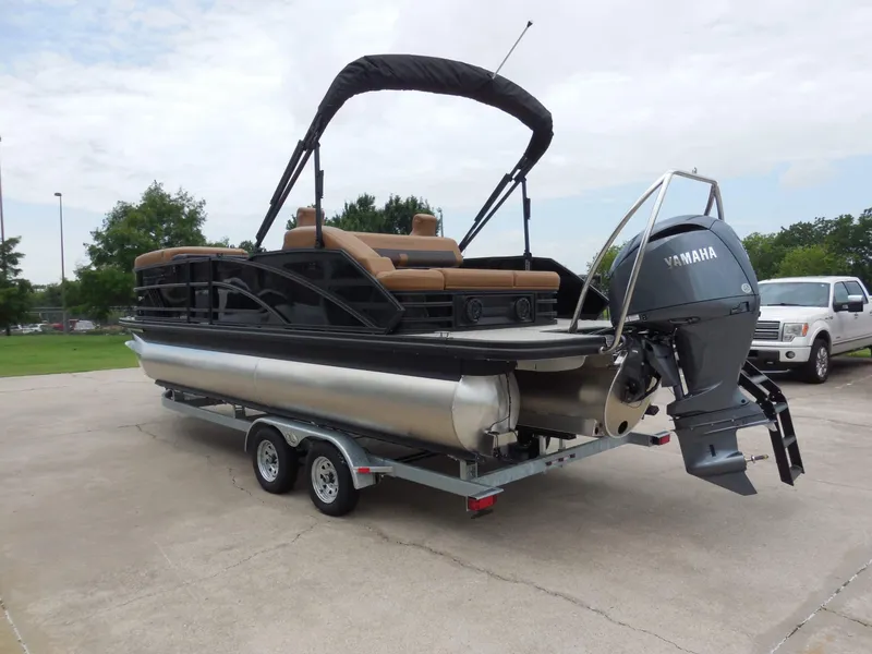 Slide: The Image of A 2026 Bennington 22MSB pontoon boat on a trailer, featuring a Yamaha outboard motor. - 6