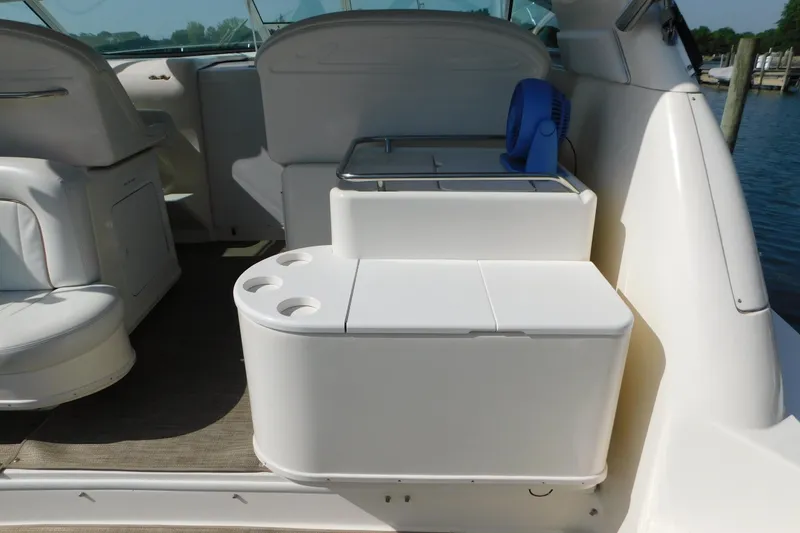 Slide: The Image of 1997 Sea Ray 330 Express Cruiser interior with seating and storage compartments. - 17