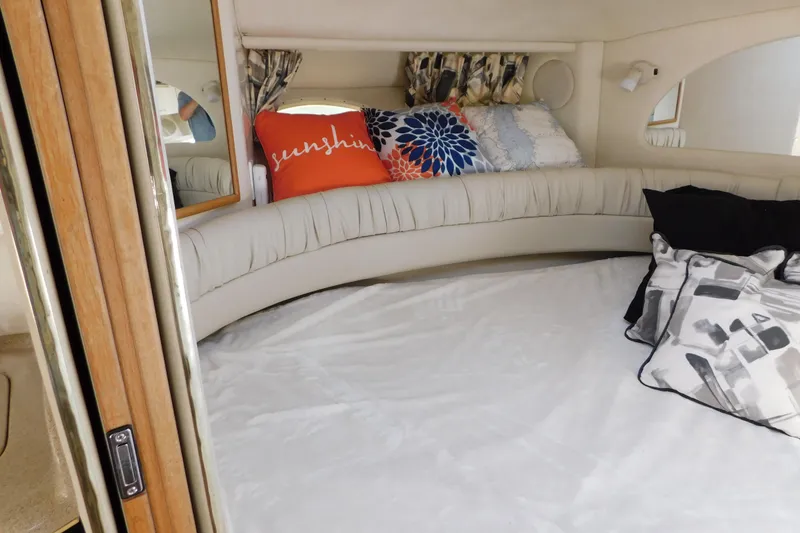 Slide: The Image of Interior cabin of a 1997 Sea Ray 330 Express Cruiser with decorative pillows. - 61