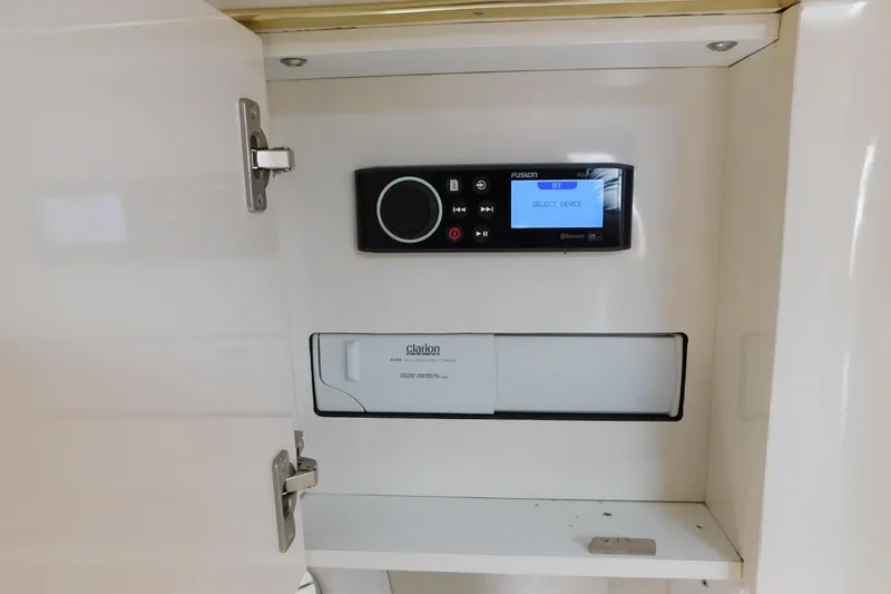 Slide: The Image of 1997 Sea Ray 330 Express Cruiser audio system with Fusion and Clarion components. - 55