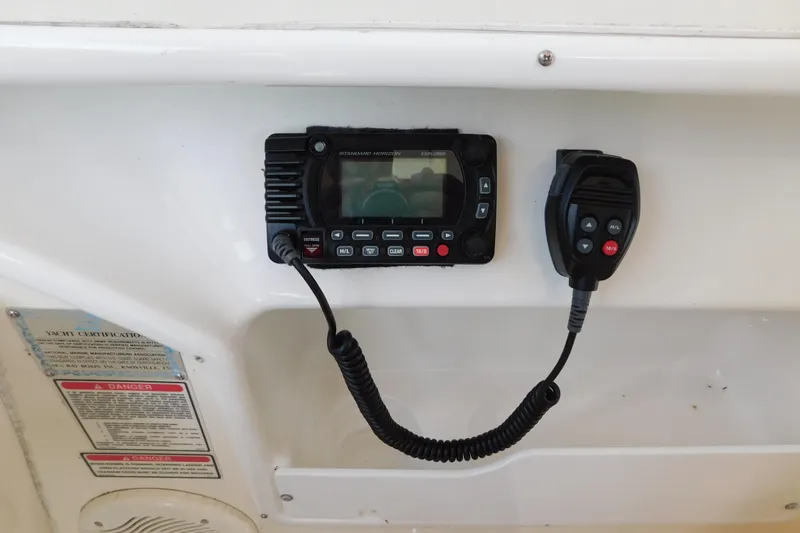 Slide: The Image of VHF radio system on 1997 Sea Ray 330 Express Cruiser boat dashboard. - 28