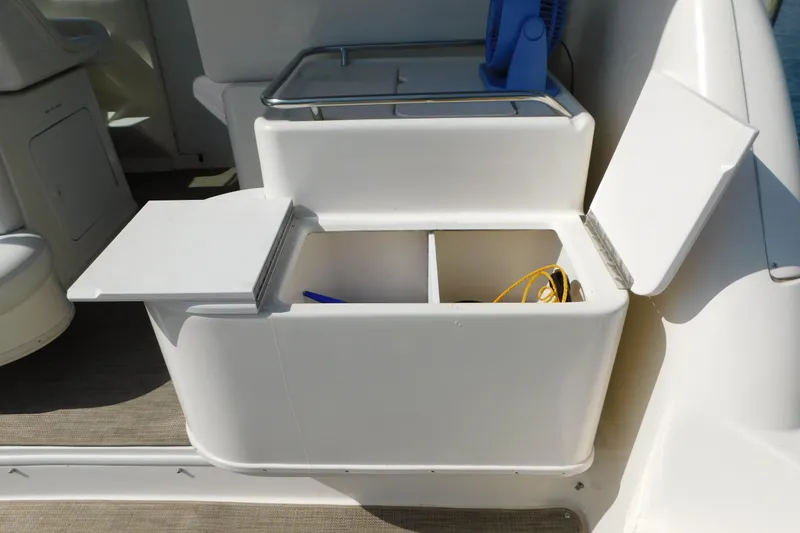 Slide: The Image of Open storage compartment on a 1997 Sea Ray 330 Express Cruiser boat. - 19