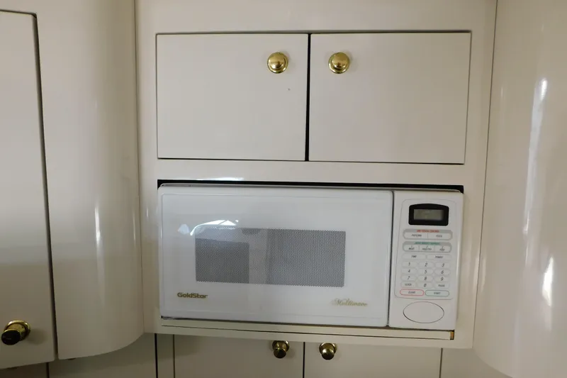 Slide: The Image of Built-in microwave in 1997 Sea Ray 330 Express Cruiser kitchen area. - 67