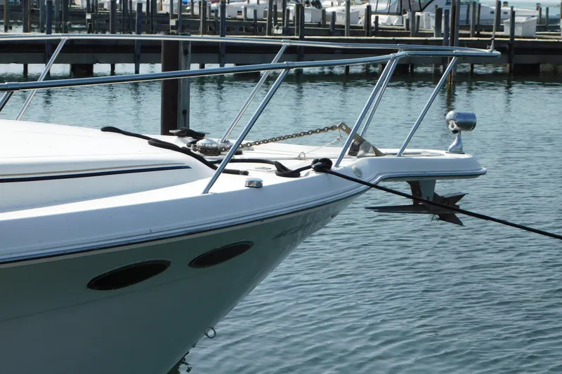 Slide: The Image of 1997 Sea Ray 330 Express Cruiser anchored at a marina. - 2