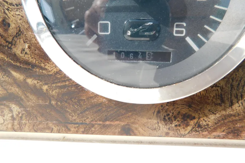 Slide: The Image of Close-up of a 1997 Sea Ray 330 Express Cruiser's dashboard gauge. - 30
