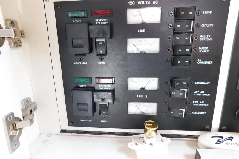 Slide: The Image of Electrical control panel on a 1997 Sea Ray 330 Express Cruiser boat. - 53