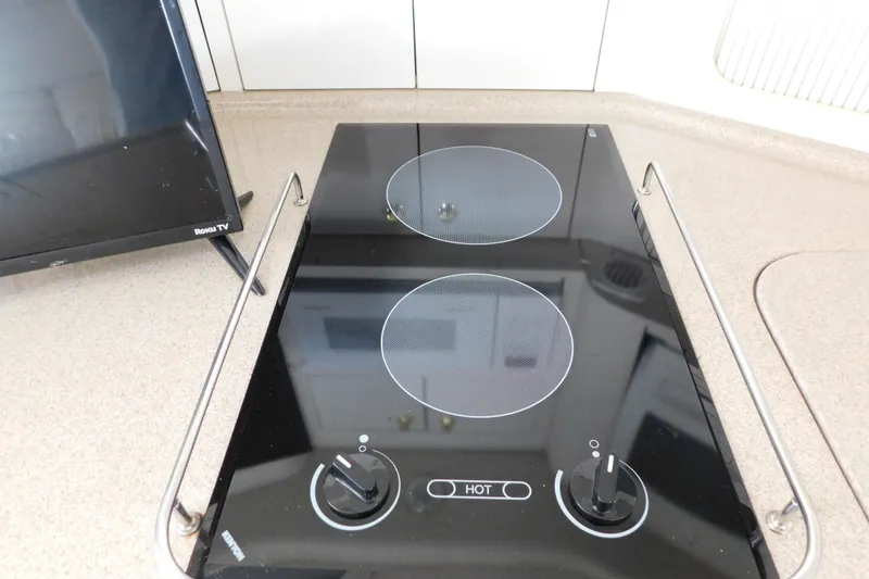 Slide: The Image of Electric stove in 1997 Sea Ray 330 Express Cruiser kitchen area. - 71