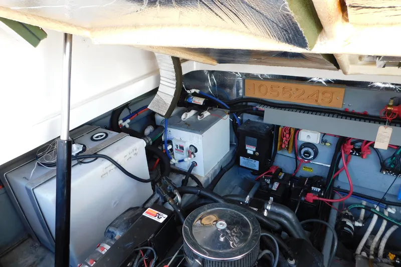 Slide: The Image of Engine compartment of a 1997 Sea Ray 330 Express Cruiser, showcasing wiring and components. - 89