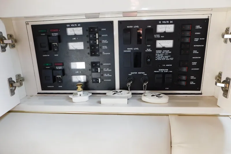 Slide: The Image of Electrical control panel of a 1997 Sea Ray 330 Express Cruiser boat. - 52