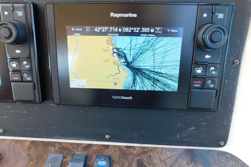 Slide: The Image of Raymarine navigation system on 1997 Sea Ray 330 Express Cruiser displaying nautical chart. - 35