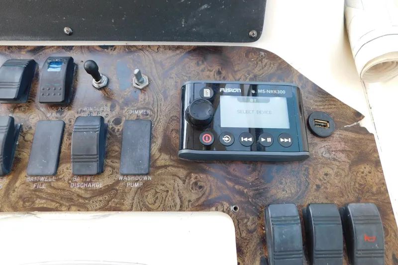 Slide: The Image of Control panel of a 1997 Sea Ray 330 Express Cruiser with Fusion MS-NRX300 stereo. - 33