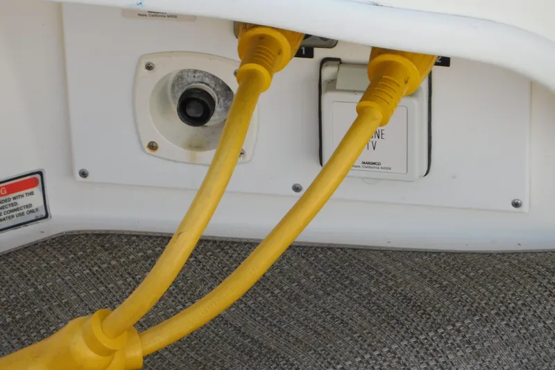 Slide: The Image of Power cables connected to a 1997 Sea Ray 330 Express Cruiser. - 83