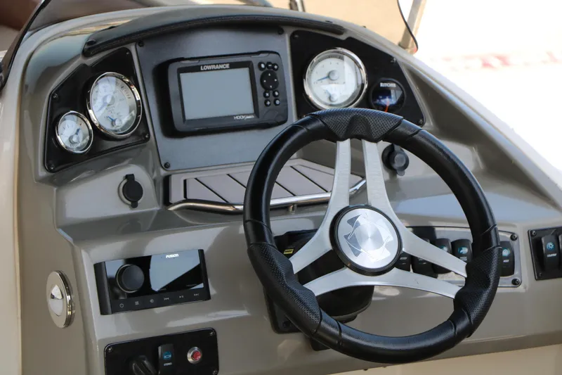 Slide: The Image of 2022 Stingray 192 SC dashboard with steering wheel and navigation instruments. - 23