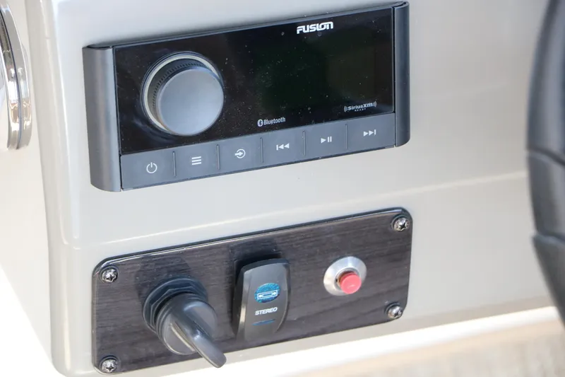 Slide: The Image of 2022 Stingray 192 SC boat dashboard featuring Fusion Bluetooth stereo system. - 44