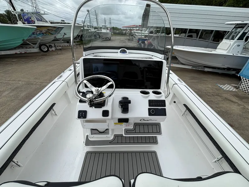 Slide: The Image of The image shows the cockpit of a Tidewater 2500 Carolina Bay boat with modern controls. - 7