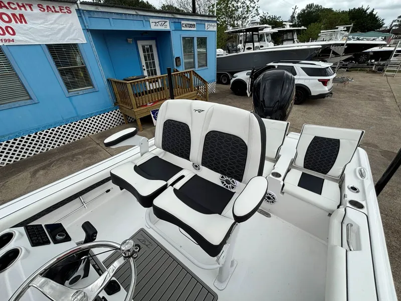 Slide: The Image of The image shows the cockpit of a Tidewater 2500 Carolina Bay boat with modern seating. - 8