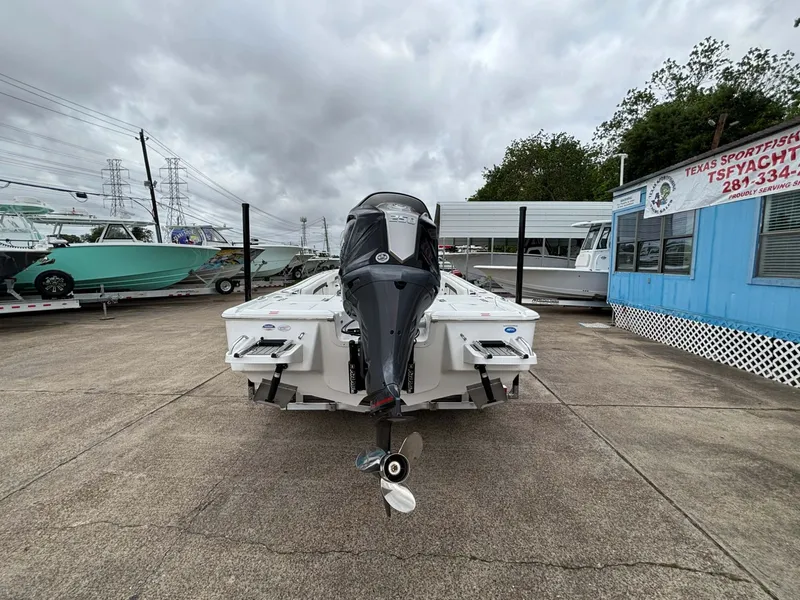 Slide: The Image of A 2026 Tidewater 2500 Carolina Bay boat is parked on a lot. It features an outboard motor. - 12