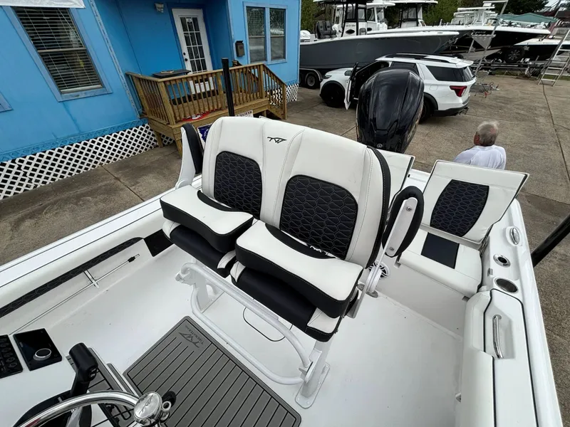 Slide: The Image of The image shows the cockpit of a Tidewater 2500 Carolina Bay boat with modern seating. - 9