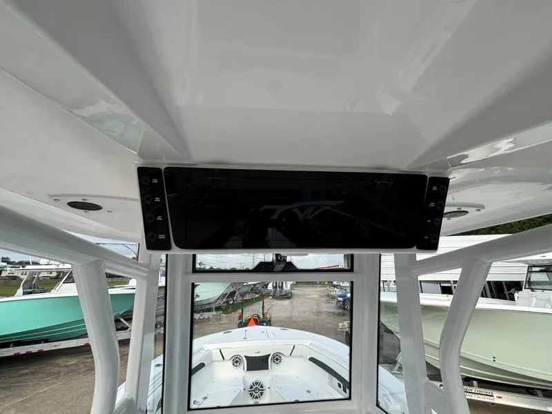 Slide: The Image of Interior view of a Tidewater 272 Center Console Adventure boat with modern electronics. - 9