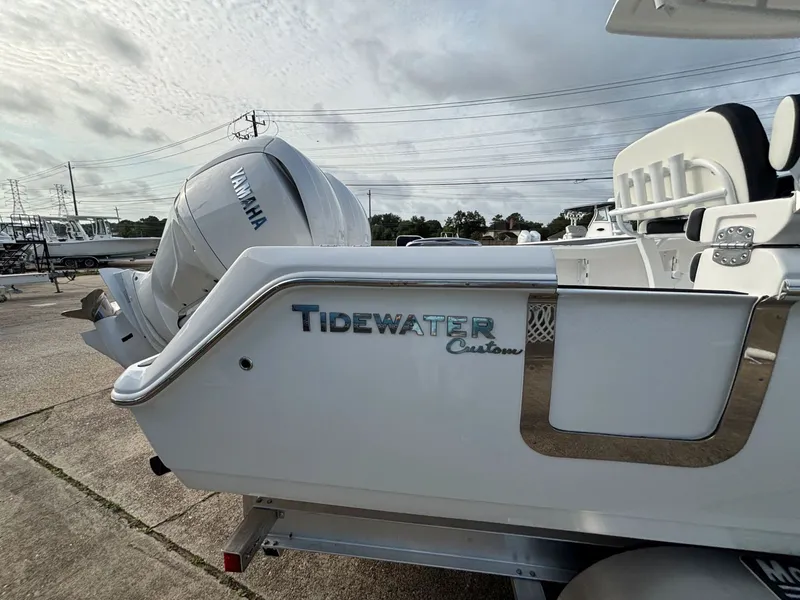 Slide: The Image of The image shows a Tidewater 272 Center Console Adventure boat with a Yamaha engine. - 15