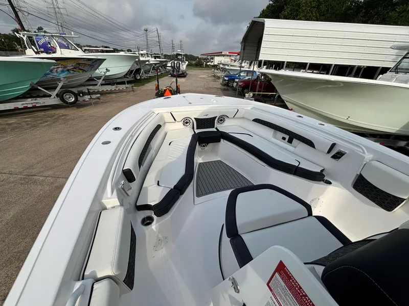Slide: The Image of The image shows the deck of a 2026 Tidewater 272 Center Console Adventure boat parked on a lot. - 6