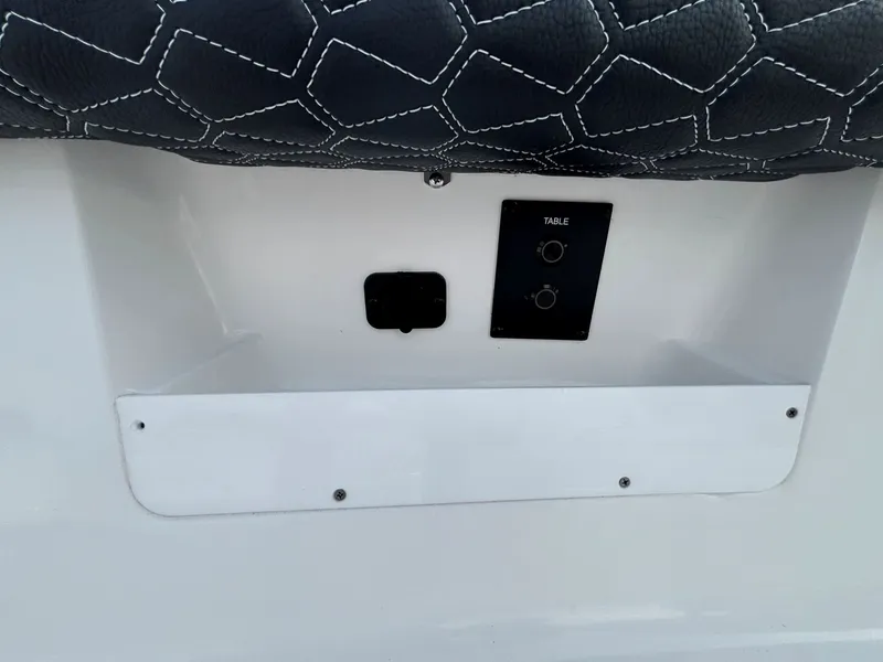Slide: The Image of Close-up of a boat panel with black buttons and quilted upholstery. - 17