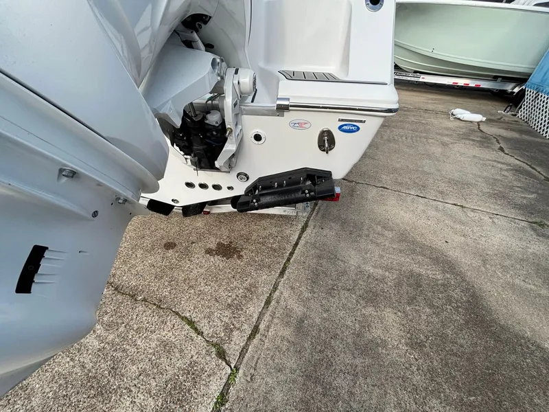 Slide: The Image of Rear view of a boat with an outboard motor on a concrete surface. - 19