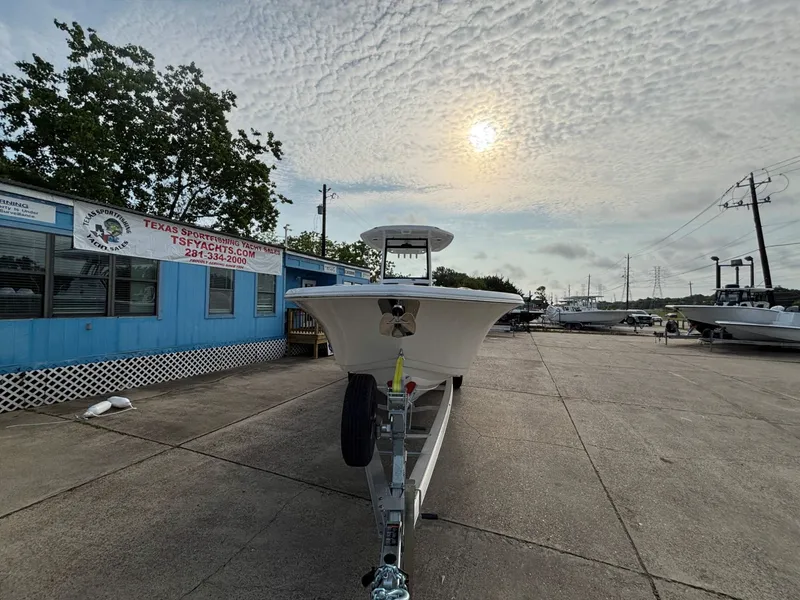 Slide: The Image of A 2026 Tidewater 272 Center Console Adventure on a trailer in front of a blue building. - 13