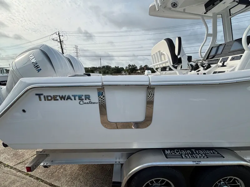 Slide: The Image of A Tidewater 272 Center Console Adventure boat on a trailer, featuring a Yamaha engine. - 18