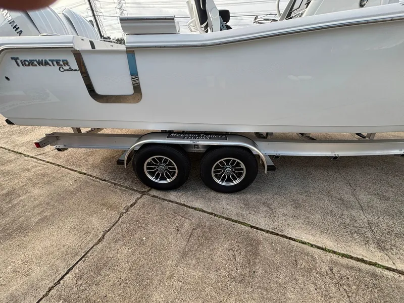 Slide: The Image of A Tidewater 272 Center Console Adventure boat on a trailer, ready for transport. - 16