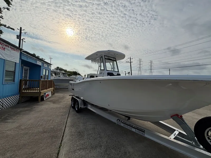 Slide: The Image of Tidewater 272 Center Console Adventure 2026 on a trailer at sunset. - 14