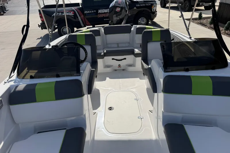Slide: The Image of 2024 Tahoe T21 boat interior with green and gray seating, showcasing modern design. - 24