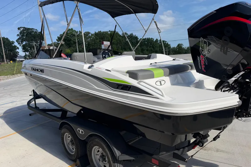 Slide: The Image of 2024 Tahoe T21 boat on trailer, featuring sleek design and powerful engine. - 6
