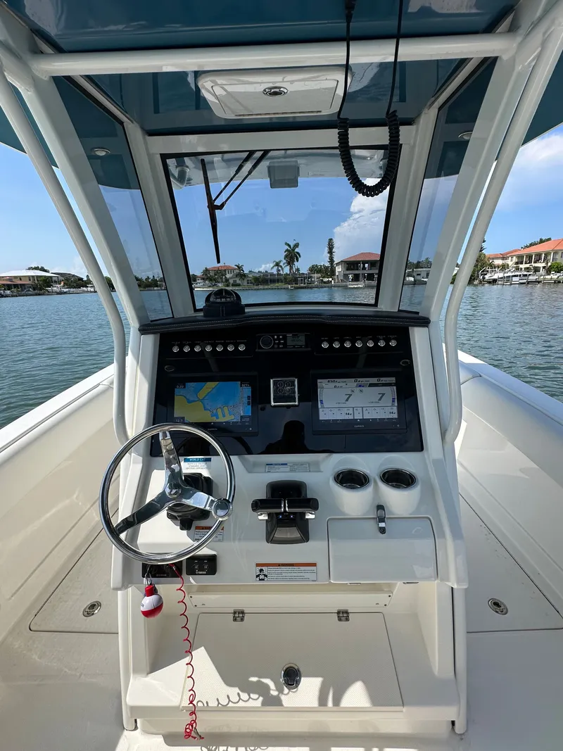 Slide: The Image of Helm of a 2020 World Cat 280 CC-X with steering wheel and navigation systems. - 47