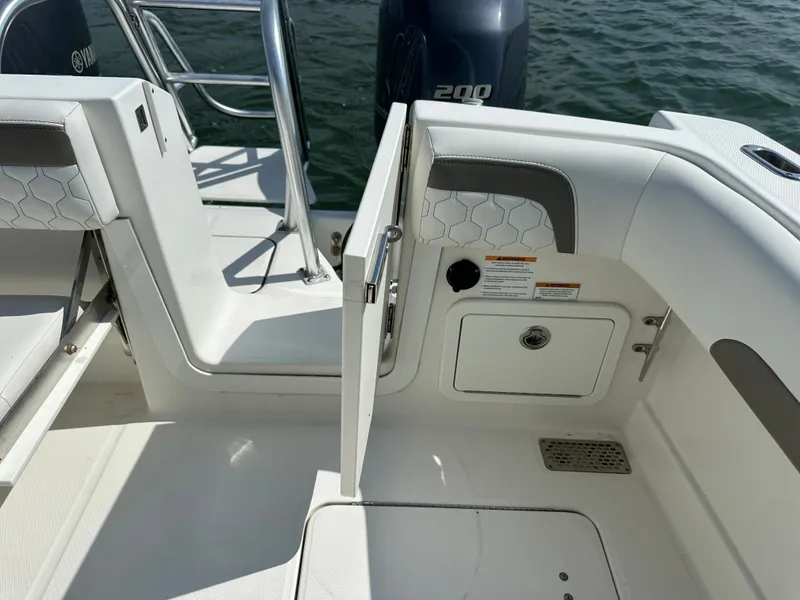 Slide: The Image of The image shows the stern of a boat with an open door and an engine in the background. - 41