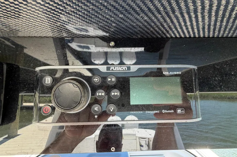 Slide: The Image of Fusion MS-AV650 marine stereo system on 2016 Edgewater 368CC boat dashboard. - 55