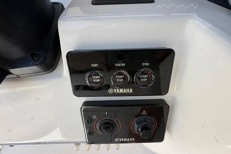 Slide: The Image of Control panel of a 2016 Edgewater 368CC boat with Yamaha start-stop buttons. - 60