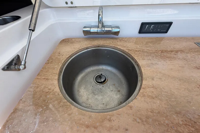 Slide: The Image of Stainless steel sink on 2016 Edgewater 368CC boat with marble countertop. - 25