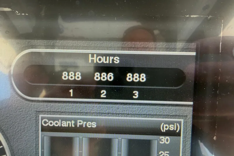 Slide: The Image of Display panel showing engine hours and coolant pressure on 2016 Edgewater 368CC. - 63