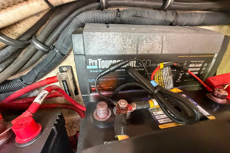 Slide: The Image of Battery and charger setup in a 2016 Edgewater 368CC boat. - 76