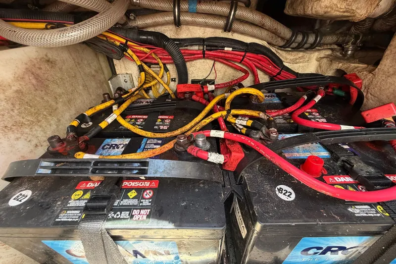 Slide: The Image of Battery compartment of a 2016 Edgewater 368CC boat with cables and connections. - 75