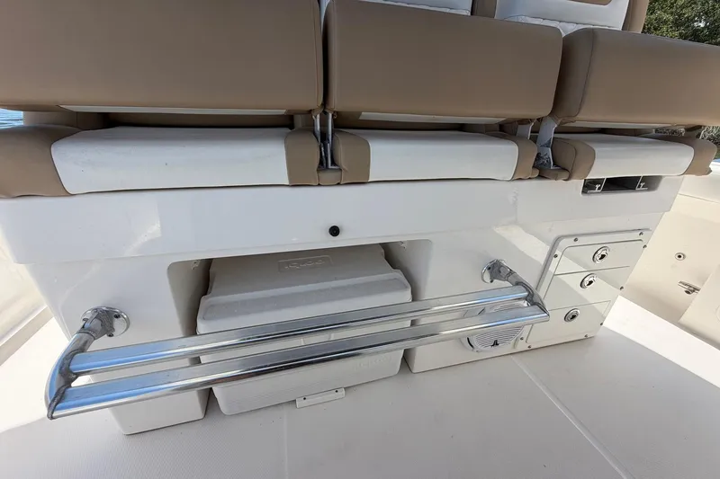 Slide: The Image of 2016 Edgewater 368CC boat interior with cushioned seating and storage compartments. - 38