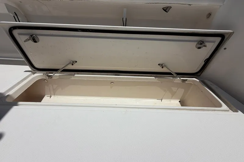 Slide: The Image of Open storage compartment on a 2016 Edgewater 368CC boat. - 28