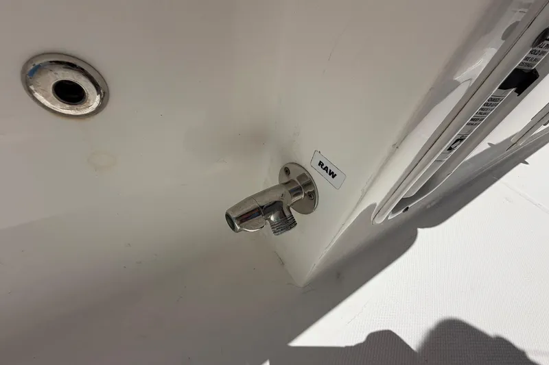 Slide: The Image of Edgewater 368CC 2016 boat raw water outlet and drain detail. - 78