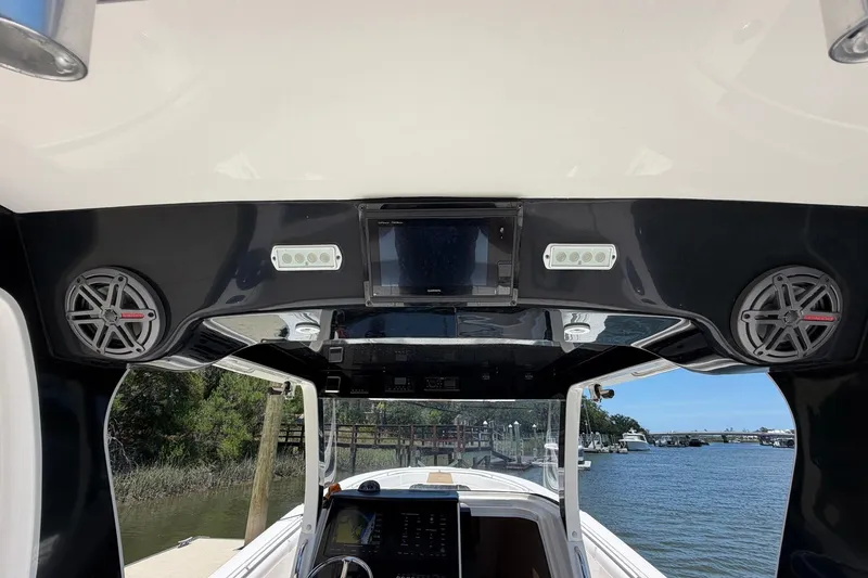 Slide: The Image of Interior view of 2016 Edgewater 368CC boat with speakers and control panel. - 26
