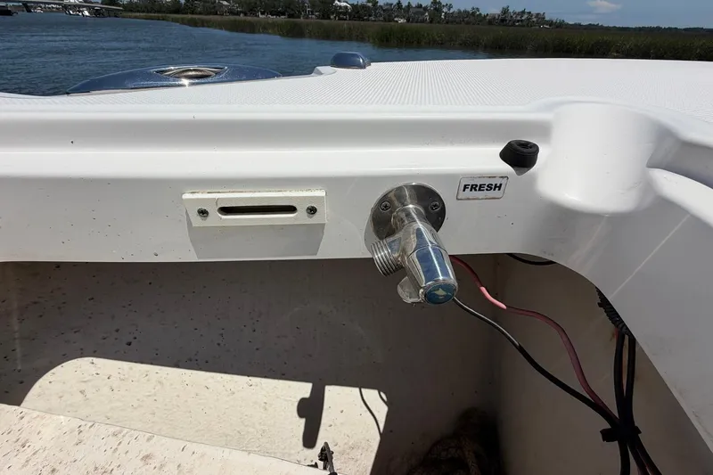 Slide: The Image of Edgewater 368CC 2016 boat detail with fresh water outlet by the water. - 77