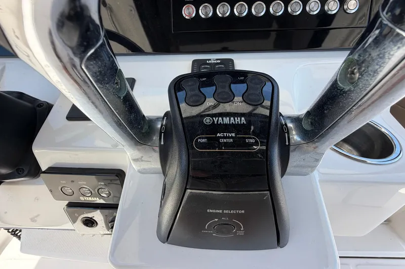 Slide: The Image of Yamaha engine control panel on 2016 Edgewater 368CC boat dashboard. - 59