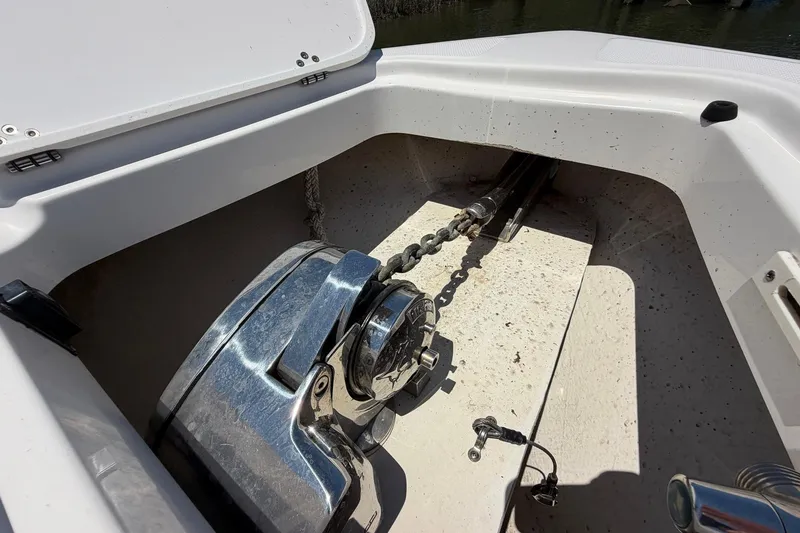 Slide: The Image of Anchor compartment of 2016 Edgewater 368CC boat with chain and winch. - 69