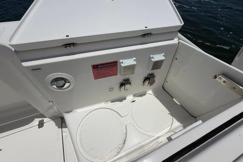 Slide: The Image of 2016 Edgewater 368CC boat deck with utility panel and warning label. - 21