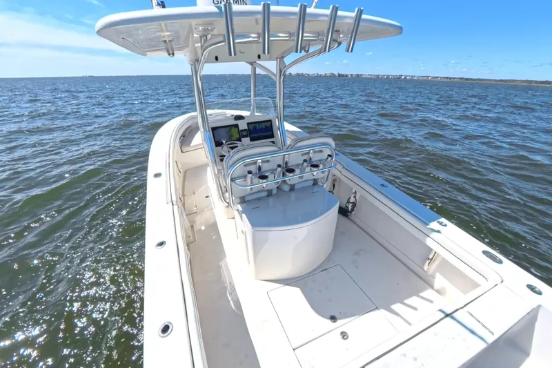 Slide: The Image of 2014 Jupiter 30 FS boat on open water, featuring a sleek design and modern console. - 13